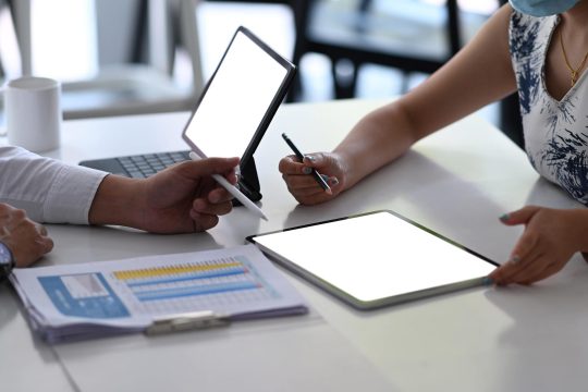 cropped-shot-of-business-people-working-with-digit-2022-03-07-17-59-05-utc-min